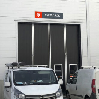 Bobcat department sign above workshop door