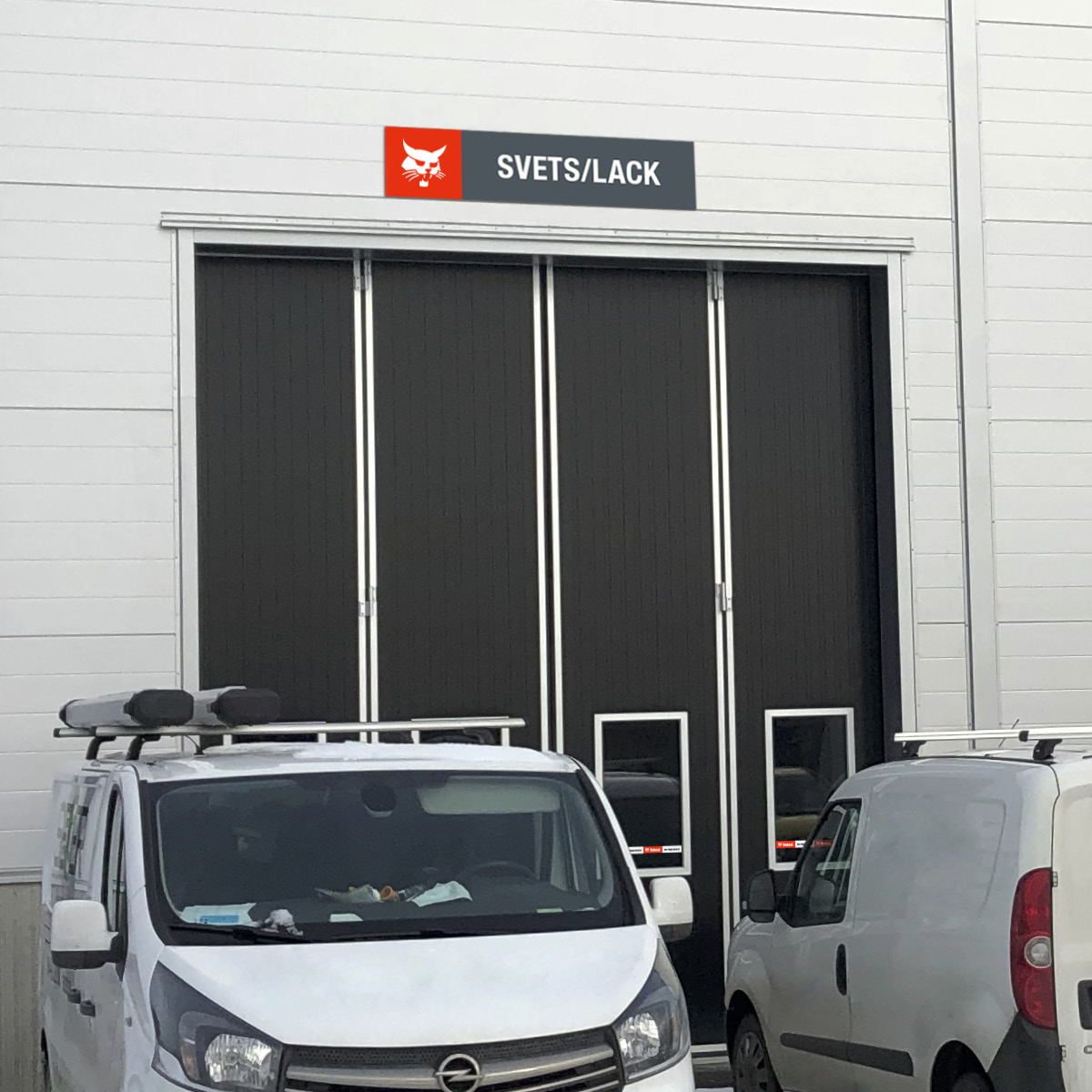 Bobcat department sign above workshop door