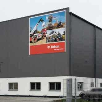 Custom mesh banner with Bobcat product motif